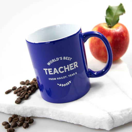Blue ceramic teacher mug with crisp white engraved personalised design