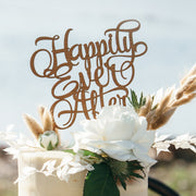 Cherry hardwood “Happily Ever After” cake topper on rustic wedding cake