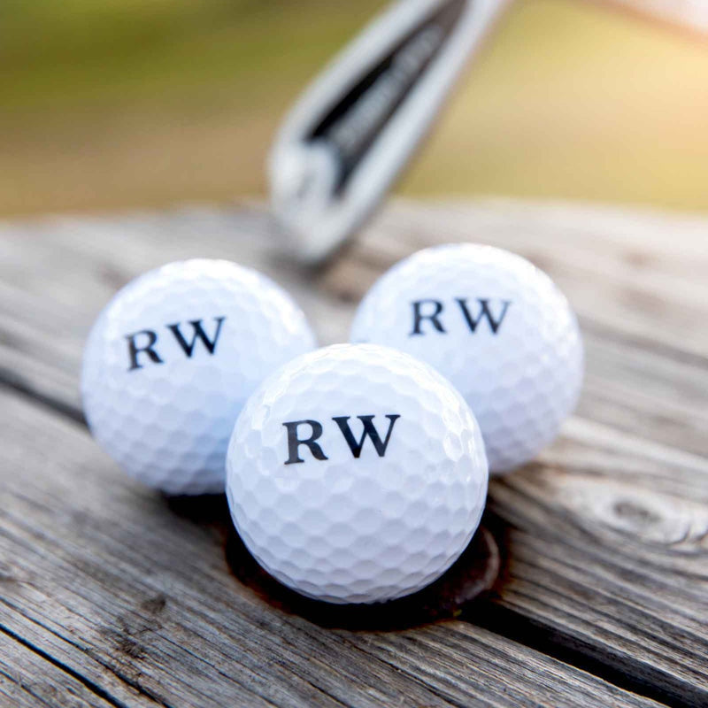 Personalised golf balls with initials in black print in gift box